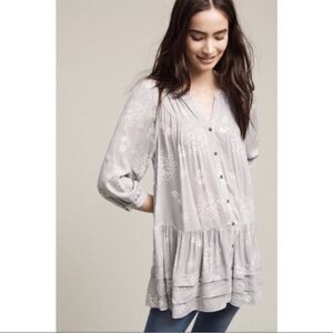 Anthropologie holding Horses floral tunic top